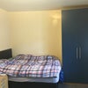 Photo 5: The bed lifts up for storage