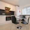 Photo 2: Open plan kitchen, dining
