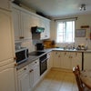 Photo 3: There is a lovely fitted kitchen with a cupboard for each person