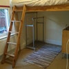 Photo 4: Raised double bed to maximise space the room is long and thin. has a set of drawers a clothes hanger