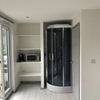 Photo 5: Shower and storage area 