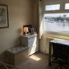 Photo 2: Desk/refreshments area, with view of marina from window 