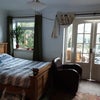 Photo 4: King size bed and conservatory 