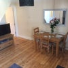 Photo 2: Communal living room/diner 