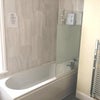 Photo 2: Bath with Electric Shower