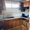Photo 2: Kitchen includes oven, fridge freezer, microwave and sink. 