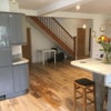 Photo 6: The open planned lounge has 65" K4 TV and beautiful new oak flooring