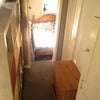 Photo 2: Shelving unit creates a corridor to the box room that I have used as double bedroom. 