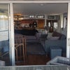 Photo 5: From the outside patio deck, looking in through the lounge to the kitchen