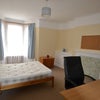Photo 3: Bright double student bedroom 1         office chair, mexican pine double bed, wardrobe, bedsidetabl
