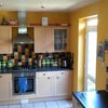 Photo 2: Large kitchen with table and chairs-not shown.There is  a large lounge with TV and sofas.