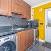 Photo 6: Utility Room with Washing and Dryer machine 