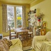 Photo 2: The dining/sitting room