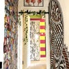 Photo 5: Kitchen hallway with pull up bar and small wall gallery of my face and body in various compromising 