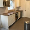 Photo 2: Kitchen with door to bathroom at rear