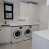 Photo 8: The utility room with separate washing machine and dryer