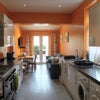 Photo 6: Modern kitchen/living area