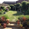 Photo 2: View of back garden from your room