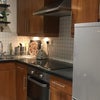Photo 4: Kitchen w/washing machine, oven, fridge freezer