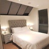 Photo 4: Main Bedroom with King Ottoman Bed