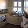 Photo 3: Kitchen with washer and dryer