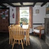 Photo 6: There is a lovely dining/sitting area area at the front of the house
