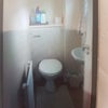 Photo 7: Down stairs toilet