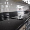 Photo 2: Granite kitchen top with induction hob