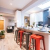 Photo 13: Communal Kitchen and Living Area