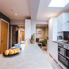 Photo 16: Communal Kitchen and Living Area