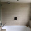 Photo 5: double ended bath with pull out shower screen