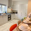 Photo 7: Communal Kitchen and Living Area