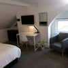 Photo 5: TV, desk, bed chair