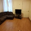 Photo 3: Large comfy corner sofa and TV, fresh paint and new lighting soon!