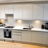 Photo 3: The kitchen is open plan and has integrated fridge, freezer and dish washer. 