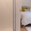 Photo 2: View from bathroom into bedroom