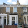Photo 1: Front view of house