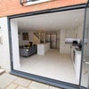 Photo 7: Bi-Folding Doors From Kitchen Area