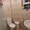 Photo 5: Shower cubicle, toilet & sink in shower room.