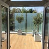Photo 3: Double doors  from kitchen/lounge leading to roof terrace
