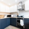 Photo 5: Communal space to cook with your housemates!