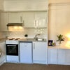 Photo 4: Kitchen / Lounge room