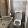 Photo 4: Lodger's own toilet/shower room, toilet view