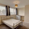 Photo 1: Bedroom with kitchette area and door to ensuite