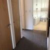 Photo 6: hallway with storage cupboards