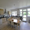 Photo 6: The kitchen, nice and spacious with a dinning table and doors to the garden
