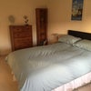 Photo 2: Bedroom showing chest of drawers and bookcase