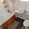 Photo 6: Bathroom with First Toilet