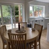 Photo 1: DINING AREA, KITCHEN, PATIO TO RIVER