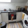 Photo 6: kitchen plus washing machine